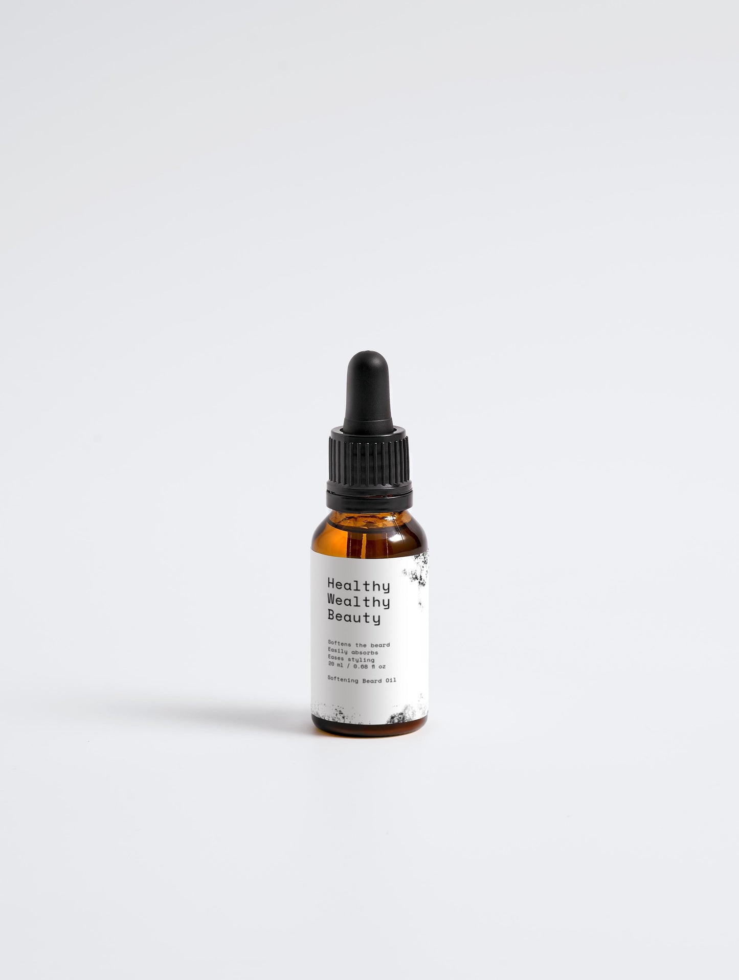 Softening Beard Oil in amber bottle with dropper for smooth, well-conditioned beards.