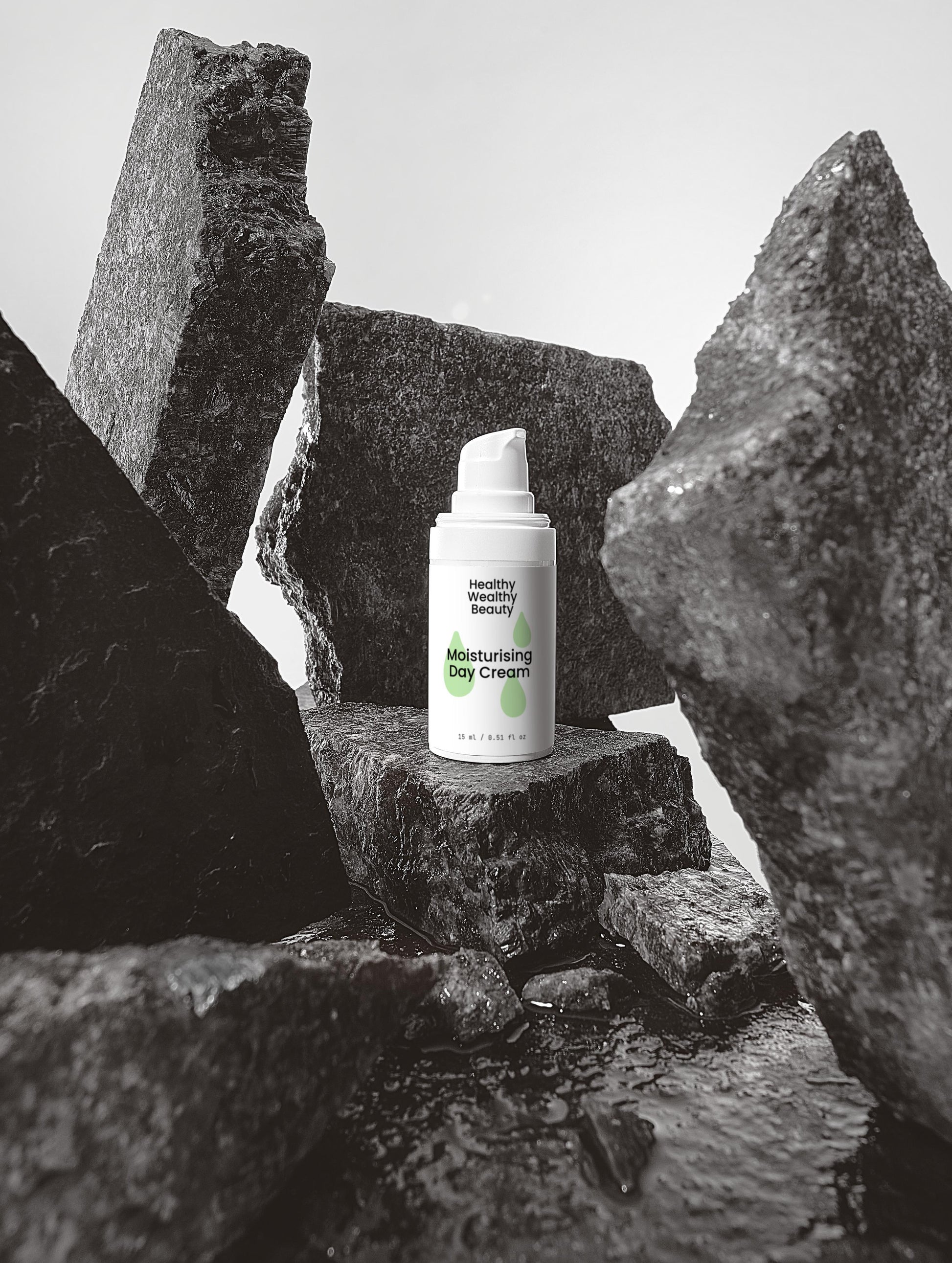 Moisturising Day Cream with Hyaluronic Acid and antioxidants in white packaging among rocks.