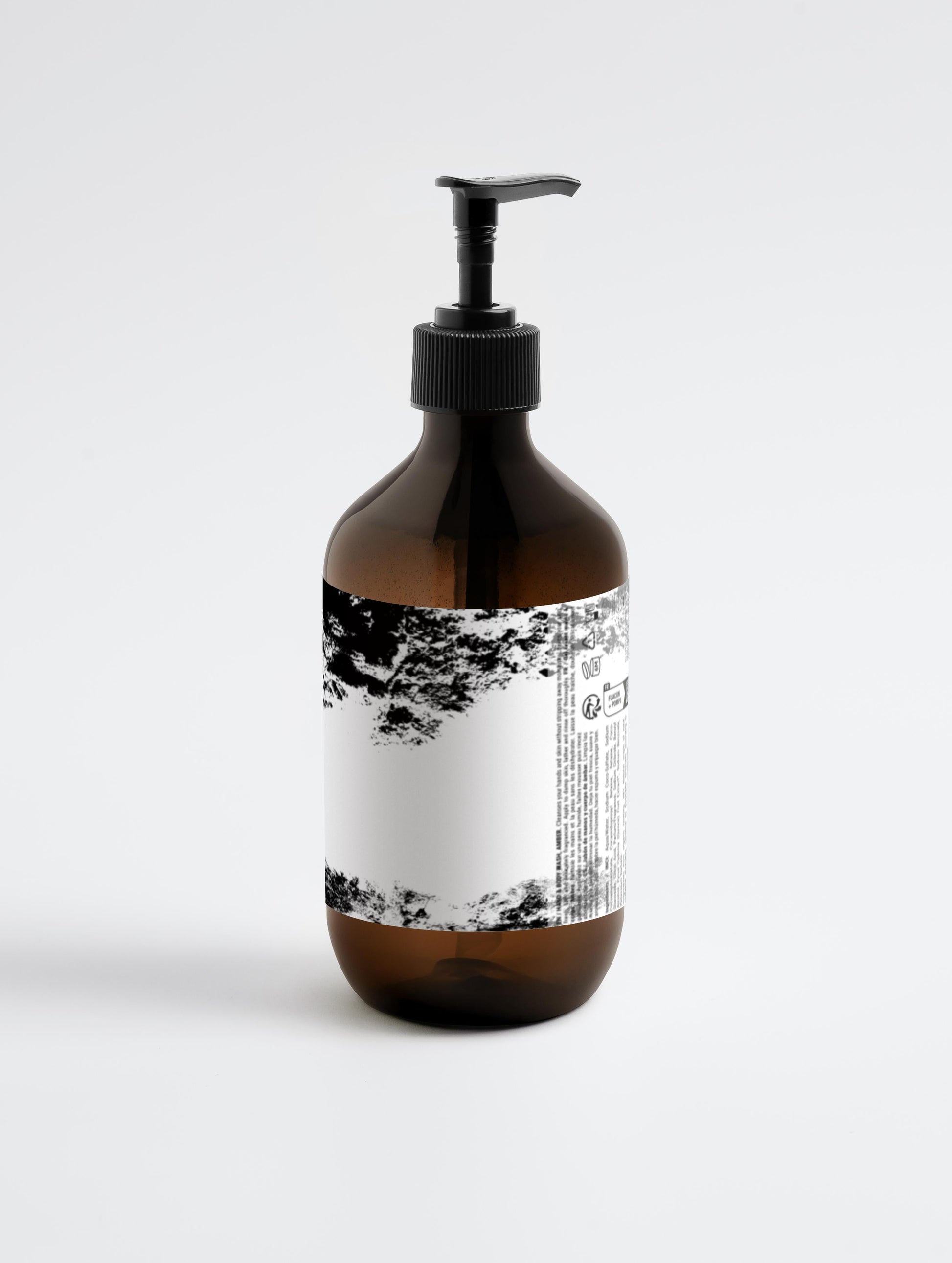 Amber bottle of Patchouli & Amber Vanilla hand and body wash with pump dispenser, designed for moisturizing and gentle skin cleansing.